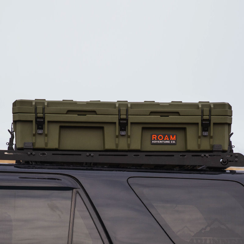 Green 95L ROAM on roof car storage on 4Runner