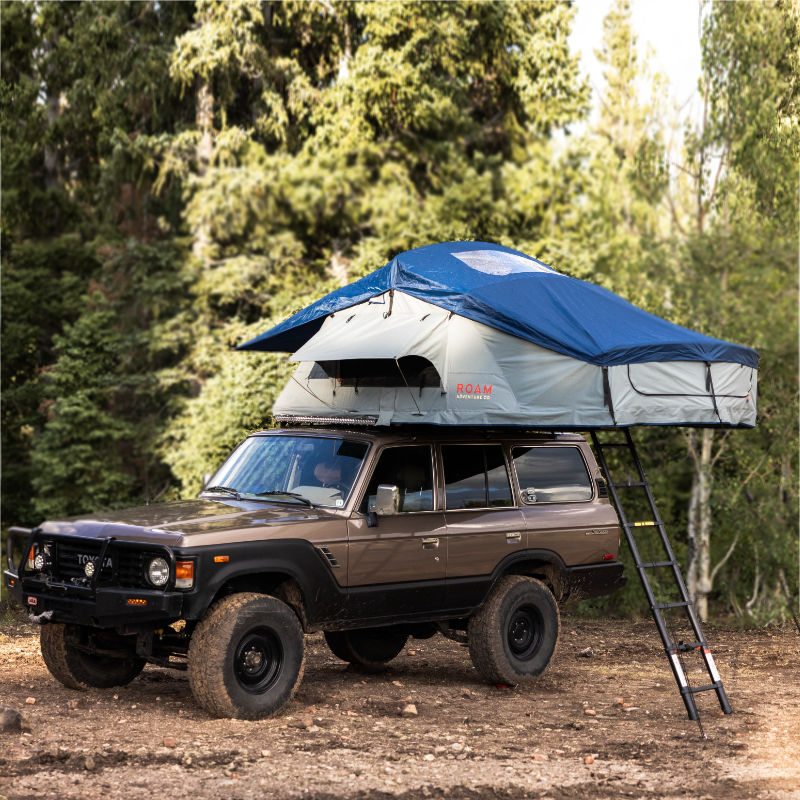 Grey ROAM roof Tent Vagabond XL set up on SUV diagonal view